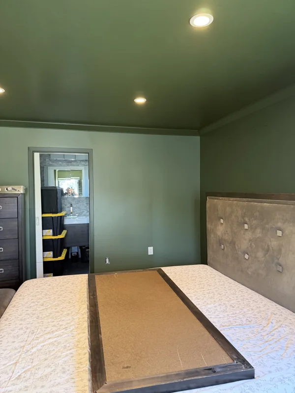 Painted walls and ceiling with recessed lighting in a bedroom.